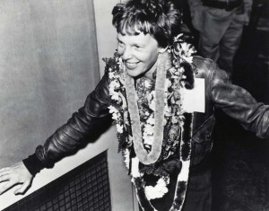Amelia Earhart wears lei upon arrival from Oakland, California, March 18, 1937 in 15 hours 47 minutes. She set a speed record for that route with four hours of fuel remaining.