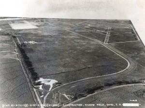 Construction at Hickam Field, January 6, 1937. By the end of 1935 the site was cleared. During 1936, the first phase had been surveyed and cut, railroad tracks and sidings constructed, and freshwater connections installed. Navy censors obliteratred Pearl Harbor. The gate house is in place at the bottom of the photo.  