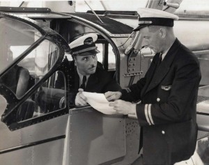 Pilot Ed Mueller receives instructions from Chief Pilot Charles Elliott.  