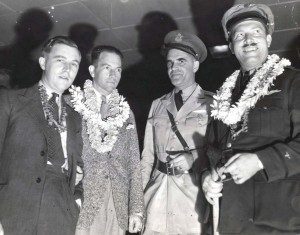 Clyde Pangborn and Roscoe Turner arrived in Hawaii on November 26, 1934 after finishing second in the London to Melbourne Air Derby. Their Boeing plane was carried on a ship to Hawaii. From left, Reeder Nichols, radio operator of the American plane; Panghorn, Capt. B. B. Cassidy, US Army, who served with Pangborn during World War I, and Turner.   