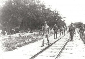 Soldiers walk along the railroad tracks at Schofield Barracks, 1933.   