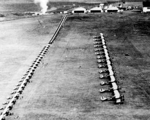 Wheeler Field squadron inspection with LB-6 aircraft in front line, O-19s in the middle, and P-12 aircraft in the back, 1930s.   