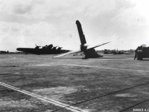 Wreckage of B-17C bomber beside Hangar 5 at Hickam Field after Japanese bombing on December 7, 1941.
