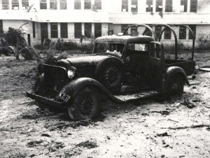 Air Corps pickup truck parked outside guard house at Hickam Field was heavily damaged, December 7, 1941. Moving vehicles were prime targets of Japanese strafers.