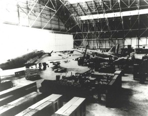 Hangar 35, Hickam Field, with B-18s and a P-26 aircraft in front of the second B-18, c1940-1941. 