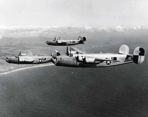 Consolidated B-24 Liberators of 867th Bomb Group of Hickam Field practice formation flying off southern tip of Kauai, 1944. 