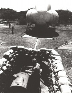 Barrage balloon and motor operated winch in sand bagged pit at Fort Kamehameha during World War II. 