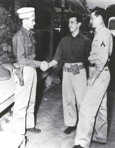 Maj. Charles Stewart (left), 86th Observation Squadron Commander, congratulates Pvt William L. Burt and PFC Ray F. McBriarty who were awarded the Silver Star for Gallantry for December 7, 1941.        