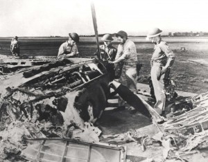 Resourceful crews remove parts from a wrecked P-40 at Wheeler Field. Of 99 P-40Bs and Cs on the island 72 were damaged or destroyed on December 7, 1941.   