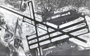 Honolulu International Airport aerial. Old Seaplane hangars can be seen in the foreground. 1950s. 