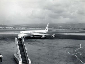 United Airlines pulls into gate at Honolulu International Airport, 1950s. 