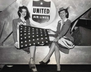 United Airlines flight attendants at Honolulu International Airport ready flight for Hawaii Statehood Commission flight to Washington, D.C., 1950s.