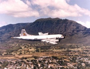 Navy Plane over Marine Corps Air Station Kaneohe, 1970s.   