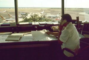 Ramp Control worker views the Central Concourse, Honolulu International Airport, 1987.