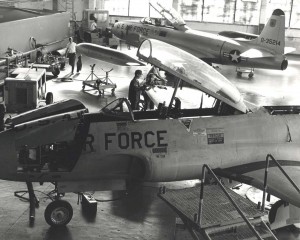 Members of the 15th Org. Maintenance Squad at Hickam Air Force Base, Hawaii, check out a recently acquired T-33 Shooting Star. The Lockheed T-33 in foreground is newer placement model, 1980s.  