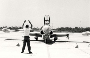 T-33A Shooting Star being guided into a parking spot at Hickam Air Force Base, Hawaii, August 2, 1985.  