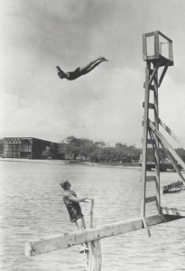 Divers enjoy the waters off of Fort Kamehameha. The seaplane hangars are in the background, 1913.