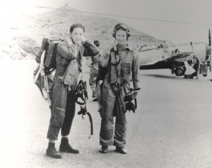 Historic photo  of military servicemen standing with an aircraft in the background