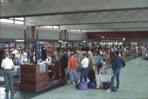 Travelers checking in at the HNL Ticket Lobby