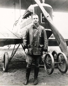 Historical photo of Capt John Curry standing in-front of his airplane