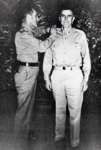 Maj. Gen. Clarence A. Tinker, commanding general of 7th Air Force, pins stars of Brig. Gen. on Col. William Farthing, Commander of the 7th Air Force Base Command, atHickam Field, October 1, 1941.