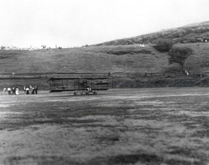 Bud Mars' biplane on the grass at Moanalua Field where approximately 3,000 people witnessed the first flight of a heavier than air machine over Hawaii soil.     