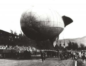 Tethered observation balloon being paraded at Kapiolani Park during 4th of July or Army Day Celebration, c1921-1923.    