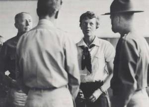 Amelia Earhart talks to Army weather experts at Wheeler Field before taking off for Howland Island on the next leg of her around the world flight, March 20, 1937.