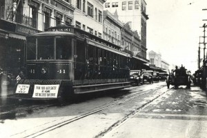 Park your auto safely at home and use the street car service in Downtown Honolulu, 1930s.   