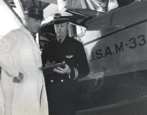 Inter-Island Airways, August 30, 1935. Captain Charles I. Elliott and William Carman, Maintenance Superintendent go over an amphibian plane.  
