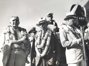 Inter-Island Airways, October 8, 1934. Postmaster Charles Chllingworth and Governor Joseph B. Poindexter listen to Harold Dillingham speak about Hawaii's new interisland air mail service.