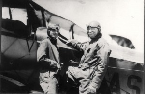 Governor W. R. Farrington stands next to unidentified aviator.