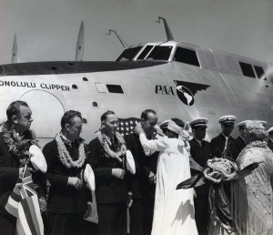 Helen Poindexter presents lei to the crew of the Pan American Honolulu Clipper at christening ceremony. 1939  