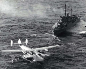 The seaplane tender USS San Pedro attempts to hook a towline to the stricken Pan American Honolulu Clipper which was downed at sea 700 miles NE of Honolulu.  