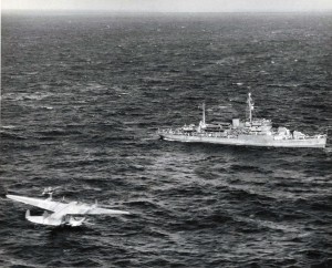 The seaplane tender USS San Pedro attempts to hook a towline to the stricken Pan American Honolulu Clipper which was downed at sea 700 miles NE of Honolulu.  