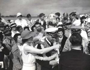 Capt. Edwin C. Musick, skipper of the Pan American Clipper receives a lei upon arrival in Honolulu April 20, 1935. His plane carried the first air mail to arrive in Hawaii.  