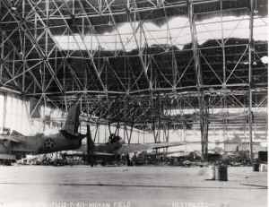 Hangar 35 Dock 1 at Hickam Field with an A-20A aircraft of the 5th Bomb Group on left and O-49 aircraft on right, December 7, 1941.   