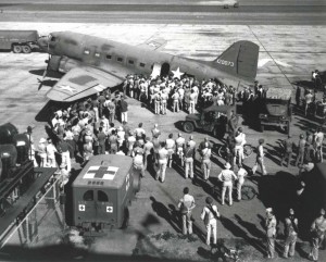 C-53 unloads wounded at Hickam Field, 1942. 