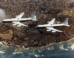 EC-135J Stratotankers (63-8056 and 63-8057) assigned to 9th Airborne Command & Control Squadron, Hickam Air Force Base, in mid air refueling operation near Diamond Head, c1957-1958.