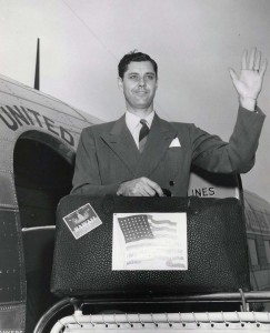 George McLean, executive secretary of the Hawaii Statehood Commission, is ready to board United Airlines plane at Honolulu International Airport for Washington, D.C., 1950s. 