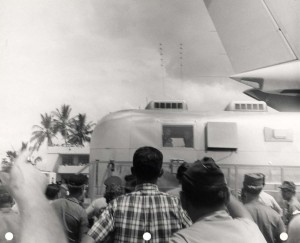 F-102 aircraft of the Hawaii Air National Guard salute the men of Apollo 11 while their mobile quarantine facility was being loaded aboard a C-141 at Hickam Air Force Base, 1969.