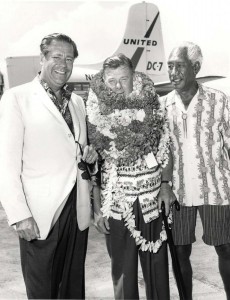 On July 12, 1964 the roadway in front of the Lei Stands at Honolulu International Airport was dedicated to legendary entertainer Arthur Godfrey. The ukulele-strumming Godfrey had been visiting the islands and promoting them on his nationally-televised radio and television shows for more than 20 years. He was a life-time aviation buff and held a commercial airline pilot certificate. He was a pilot/ambassador for Eastern Airlines and even took pilot certification lessons from Hawaiian Airlines. He's shown here with Lee Holtzman, general manager of the Royal Hawaiian Hotel, and the legendary Duke Kahanamoku.