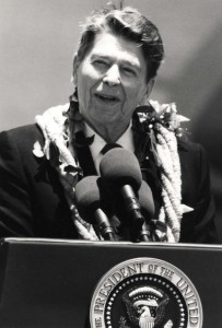 President Ronald Reagan speaks to a crowd of more than 4,000 people who gathered at Hickam Air Force Base, Hawaii, Base Operations to greet him upon his arrival in Hawaii, April 26, 1986.  