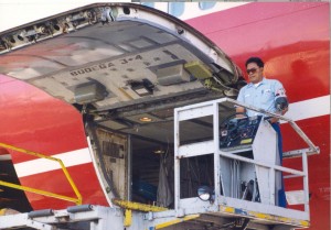 Loading baggage aboard an aircraft, Honolulu International Airport, 1994.
