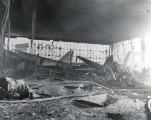 Destruction inside a hangar at Hickam Field shortly after initial raid, December 7, 1941. On left is B-18 assigned to 5th Bombardment Group. 